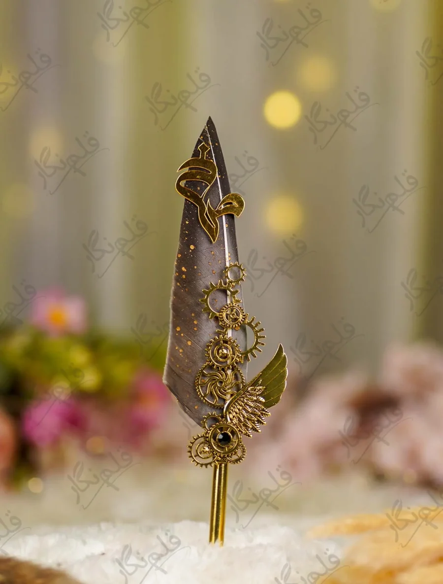 Side angle of the metal wing emblem and cogs with black gemstone
