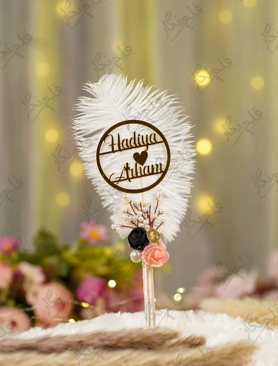 Elegant floral themed wedding signing pen lying on a soft white fur backdrop