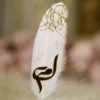 Sleek metal handle of the white feather Nikkah signing pen
