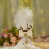Handmade white feather Nikkah pen with a cream satin bow and pearl-lined spine