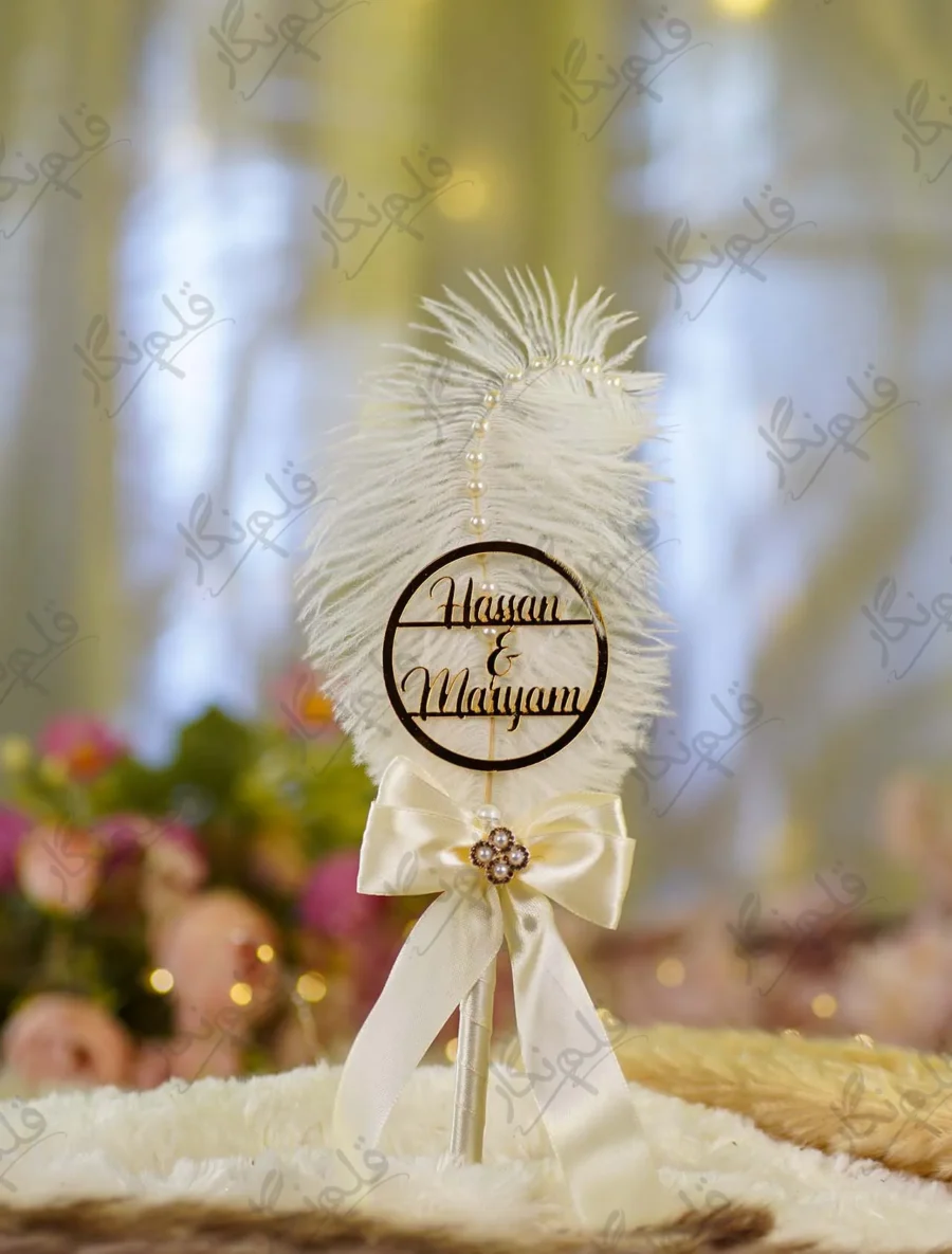 Front view of the complete Cream Pearl Bow White Feather Nikkah Pen