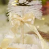 Detailed view of gold mirror acrylic Qabool Hai calligraphy on white feather Nikkah sign pen