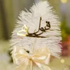 Close up of cream satin ribbon bow and pearl bead accent on Nikkah pen