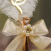 Custom gold mirror acrylic calligraphy script nameplate on white feather