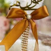 Close up of the golden mirror acrylic Qabool Hai calligraphy on the signing pen