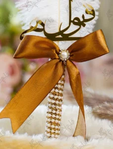 Close up of the golden mirror acrylic Qabool Hai calligraphy on the signing pen