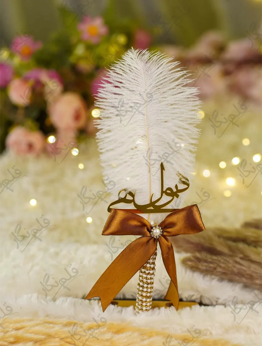 Side angle of the bronze ribbon bow with pearl and rhinestone button centerpiece