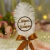Front view of the gold mirror calligraphy on the white feather Nikkah pen