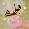 Detailed view of the pink satin wrapped handle with gold rhinestone spiral