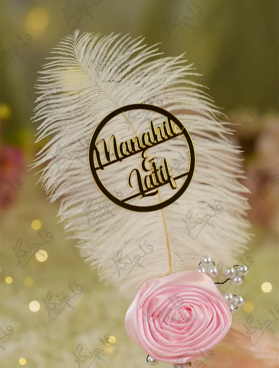 Elegant pink themed Nikkah pen lying on a soft decorative fabric backdrop