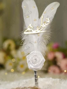 Detailed view of the scattered white pearl beads on the feather surface