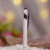 White stylus metal Nikkah pen showing the black touchscreen stylus tip