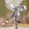 Close up of the golden mirror acrylic custom couple nameplate on the feather