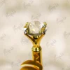 Polished gold metal barrel of the Nikkah signature pen before customization