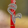 Close up of the red metal pen barrel with gold joint accents