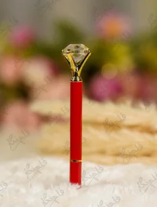 Glossy red Nikkah pen topped with a clear crystal diamond and gold settings