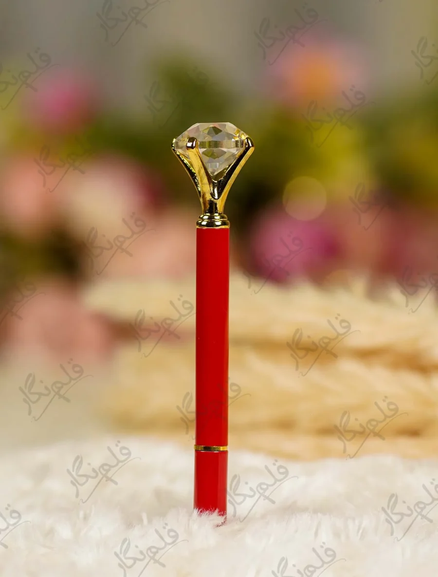 Glossy red Nikkah pen topped with a clear crystal diamond and gold settings