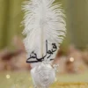 Detailed close up of the gold bead chain spiral on the white handle