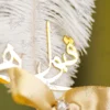 Detailed shot of the gold satin ribbon bow and pearl rhinestone button center