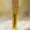 Close-up of the multi-faceted crystal diamond top set in gold prongs
