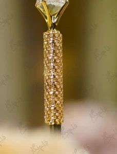 Detail shot of the gold rhinestone mesh wrapped around the pen body