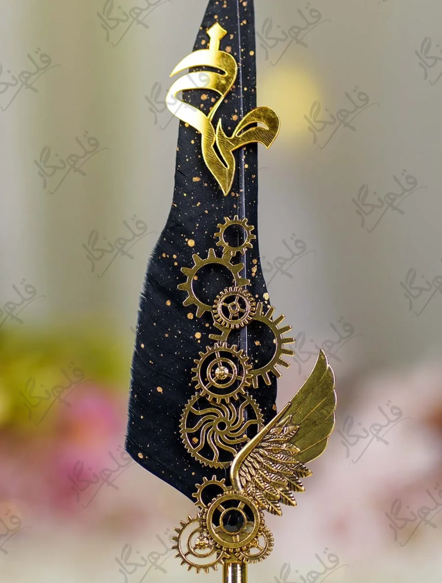 Close up of mechanical gold gears and wing decoration on black feather signing pen