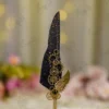 Side angle of the gold gears and wing assembly on black wedding pen