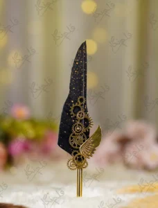 Side angle of the gold gears and wing assembly on black wedding pen
