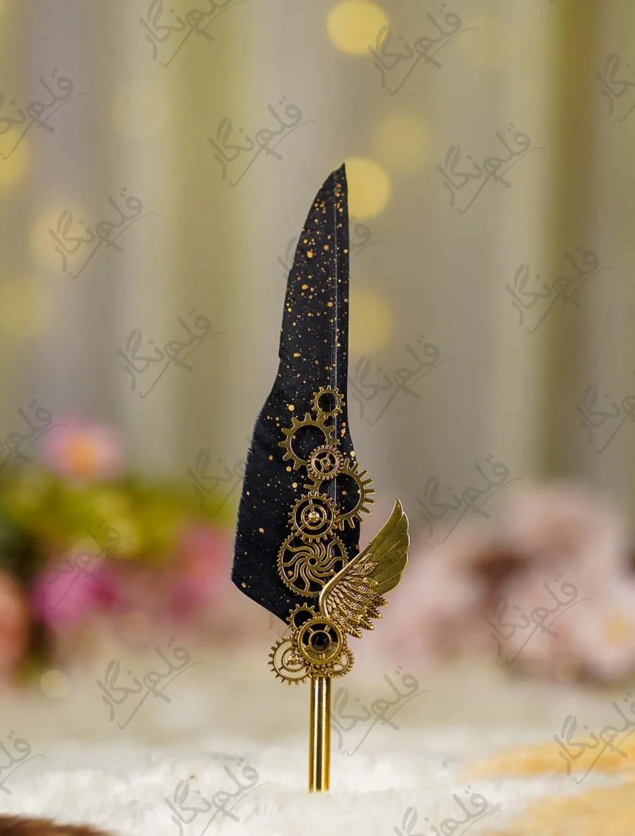 Side angle of the gold gears and wing assembly on black wedding pen