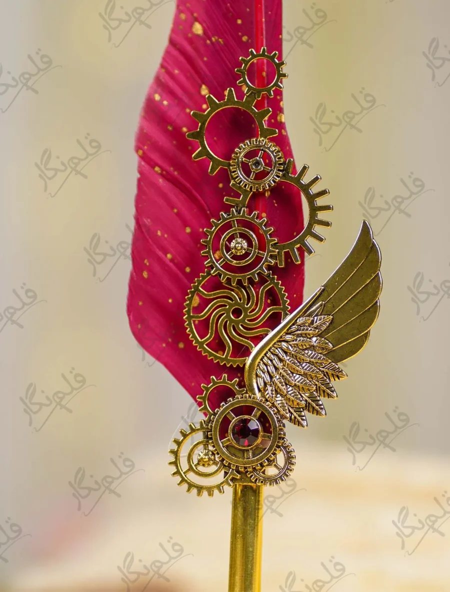 Detailed view of red gemstone set inside the gold gear of the Nikkah pen