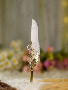White feather Nikkah pen with gold splatters and interlocking gold steampunk gears