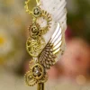 Elegant steampunk Nikkah signing pen displaying gold gears against a soft background