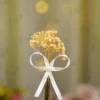 Polished gold metal Nikkah pen topped with dried yellow baby's breath flowers