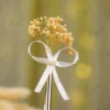 Close up of the natural dried gypsophila flowers and white satin bow