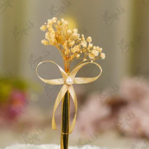 Close up of the champagne satin ribbon bow and central pearl bead accent