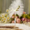 Detailed close up of Urdu Qabool Hai script cutout on white feather signing pen
