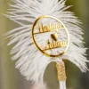 Personalized version of the white feather Nikkah pen showing gold mirror acrylic couple nameplate with heart
