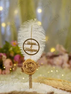 Handmade white feather Nikkah pen with a gold satin rose and rhinestone spine