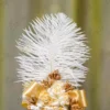 White satin ribbon-wrapped stem showing the gold glitter spiral overlay