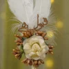 Golden beaded stamen sprigs and ivory wrapped pen handle close up