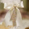 High angle close up of the ivory bow and gold mesh assembly