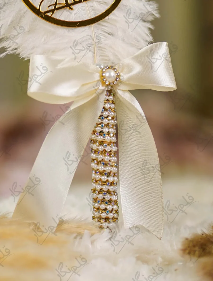 High angle close up of the ivory bow and gold mesh assembly