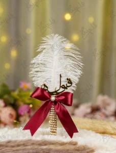Gold pearl mesh Nikkah pen with maroon bow and white feather
