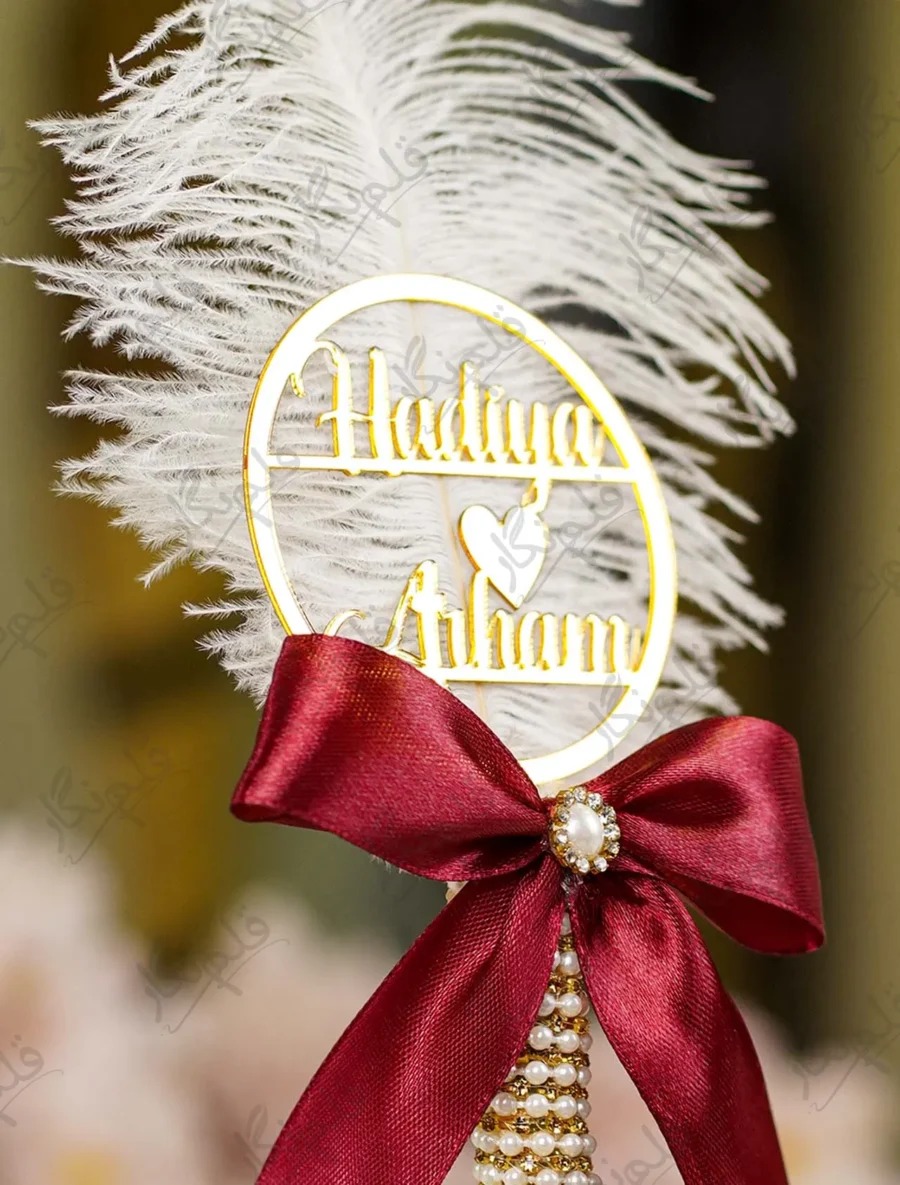 High angle close up of the maroon bow and gold mesh assembly