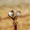 Close-up of the custom gold mirror acrylic calligraphy name cutout on the pen