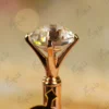 Faceted clear crystal glass diamond top in rose gold crown-prong setting