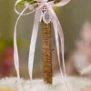 Detailed shot of the pink satin ribbon bow, white lace backing, and jute wrapping
