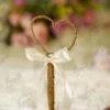 Handmade rustic Nikkah pen wrapped in brown jute rope with a cream satin bow