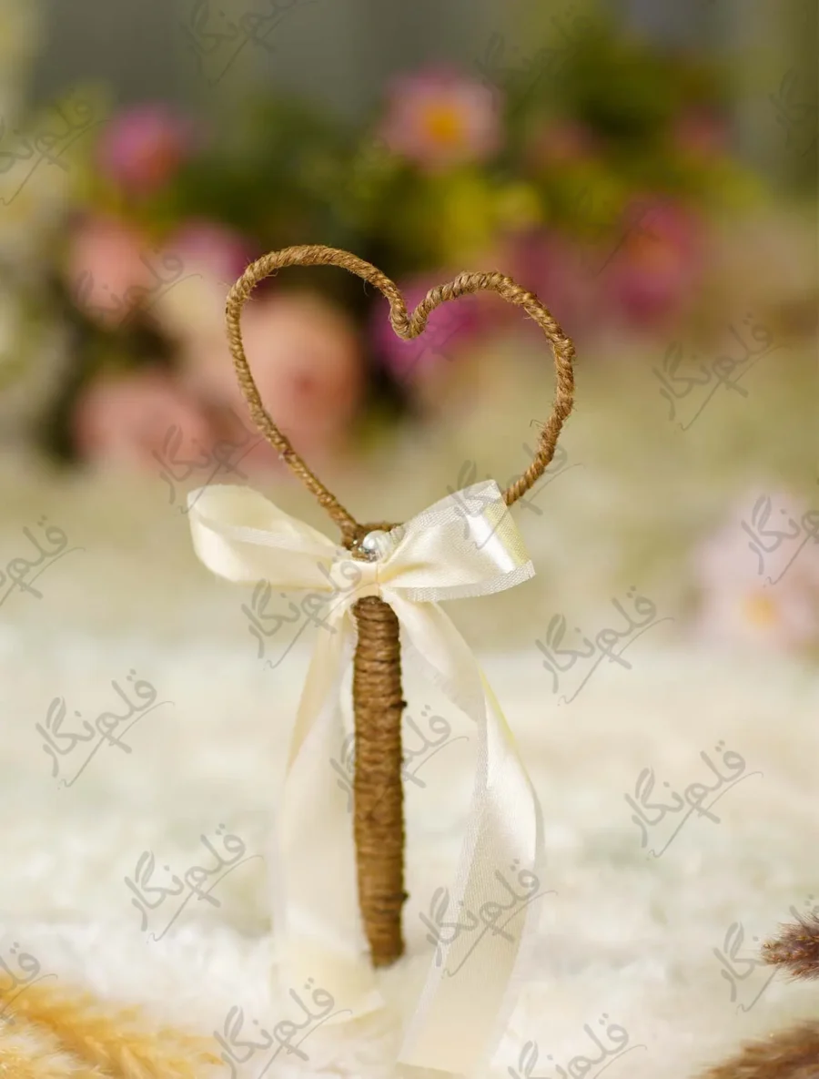 Handmade rustic Nikkah pen wrapped in brown jute rope with a cream satin bow