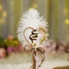 Close up of the golden mirror acrylic Qabool Hai calligraphy on the feather